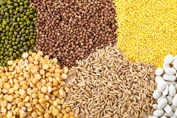 Different grains and cereals as background, top view
