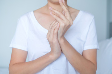 Woman applying moisturizing cream/lotion on hands, beauty concept..