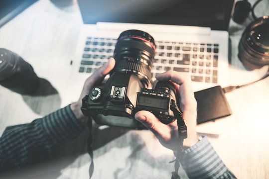 photographer hand camera on desk