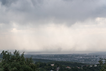 Heavy rain with the wind over the city of Almaty, Kazakhstan
