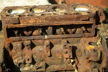 old rusty boat engine on beach background