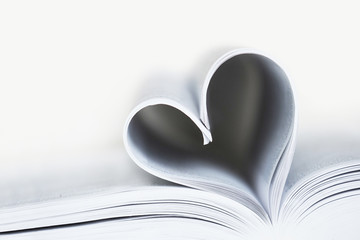 Open book, black and white image. Heart shaped book sheets