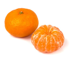 Two ripe mandarins close-up on a white background.