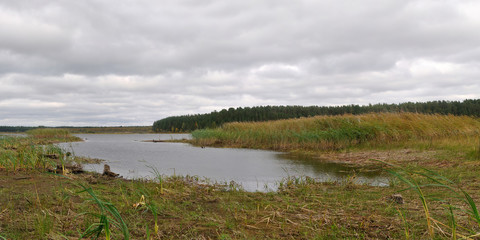 Autumn fishing on the Rybinsk Reservoir, beautiful panorama.