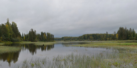 Autumn fishing on the Rybinsk Reservoir, beautiful panorama.