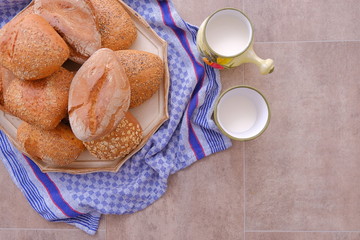 many buns on the table with milk