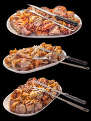 Fresh Spit Roasted Pork Meat Slices Offered on Porcelain Platter With Carving Knife and Serving Fork Side View Isolated on Black Background