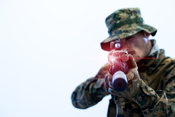 soldier in action aiming laseer sight optics