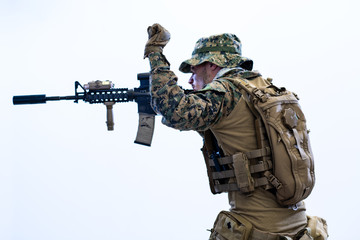 Fototapeta na wymiar soldier in action aiming laseer sight optics