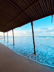 Seascape, sea view from under the bamboo roof. Travel Asia