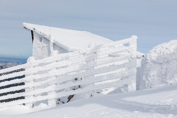 Wooden fences that delimit access to the track of the Navacerrada ski resort in Madrid