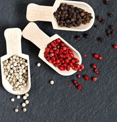 Pepper Peas Different Types against the background of black slate. Pepper Peas-Black, White, Red. copy space. space for text