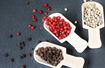 Pepper Peas Different Types against the background of black slate. Pepper Peas-Black, White, Red. copy space. space for text