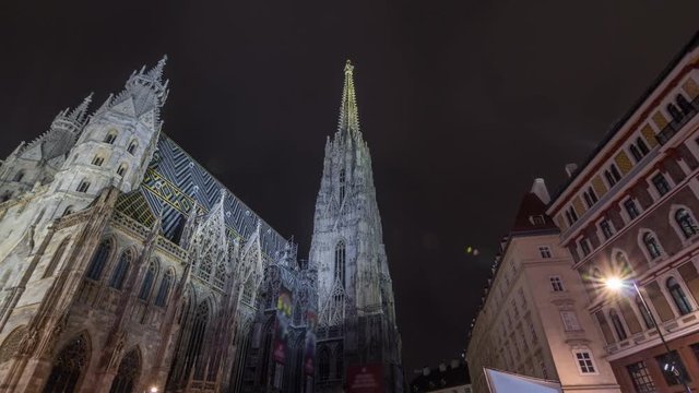 St. Stephen's Cathedral night timelapse hyperlapse (Stephansdom, Domkirche St. Stephan), the mother church of Roman Catholic Archdiocese of Vienna and one of the tallest churches in the world