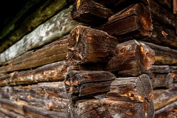 Old wooden log house near forest.