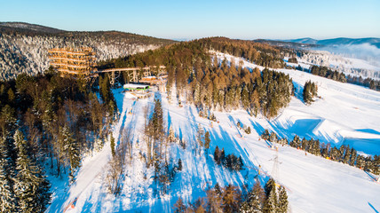 Tree Top Observation Tower in Slotwiny near Krynica in Poland at Winter Season. Aerial Drone view