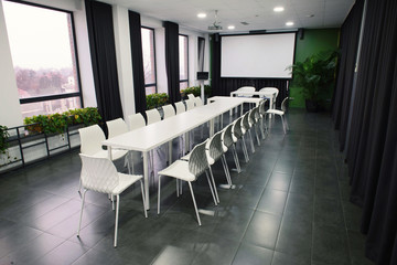 photo of office or conference room with white office furniture