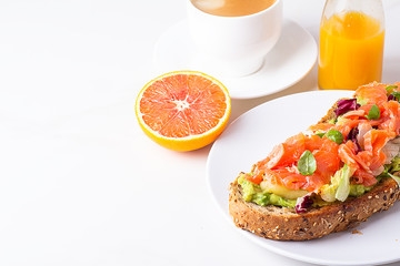 salmon toast,, black coffee and juice for breakfast