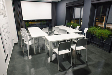 photo of office or conference room with white office furniture