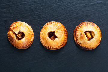 Food valentine idea concept fresh baked Homemade apple cinnamon hand pie on black background