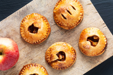 Food valentine idea concept fresh baked Homemade apple cinnamon hand pie on black background