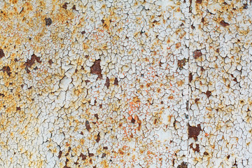 texture of an old rusty sheet of metal painted with white paint burnt out in the sun