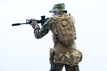 Fototapeta premium soldier in action aiming laseer sight optics