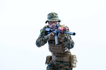 soldier in action aiming laseer sight optics