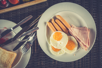 Typical breakfast with eggs, bacon and sausage