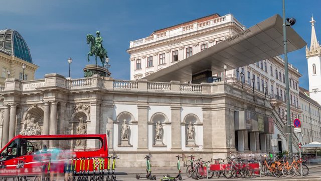 Front view of equestrian statue of Archduke Albert with fountain in front of the Albertina Museum timelapse hyperlapse in Vienna, Austria. Historic buildings on a background