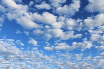 Perspective background with blue sky and lots of white clouds