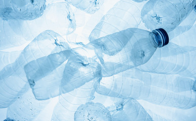 Empty plastic bottle (Polyethylene Terephthalate or PET bottle) on the plastic bottles background....