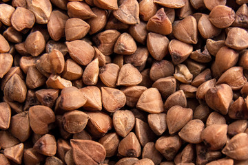 Background of dried buckwheat with whole large kernel / Diet concept / Close up
