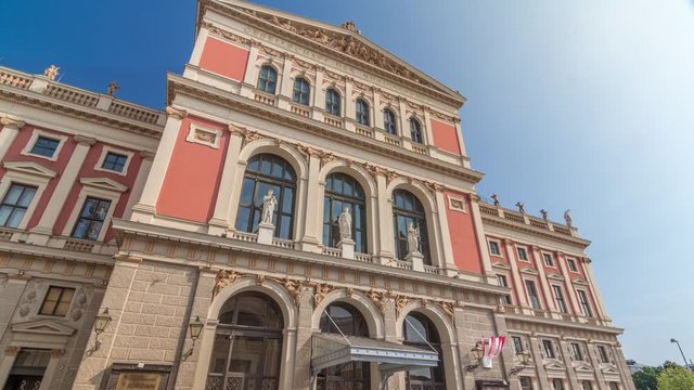 The Wiener Musikverein timelapse hyperlapse (Viennese Music Association) is a famous Vienna concert hall. It was built in 1870. Front view with blue sky