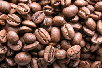 Coffee beans. Whole coffee beans background. Fresh coffee. Close up.