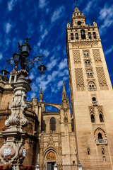 Giralda Sevilla Cathedral and street light. Andalusia, Spain.