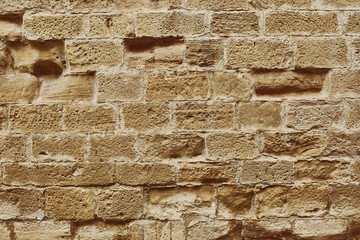 sandstone wall with stones as a background
