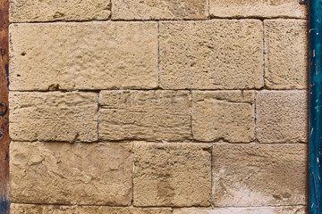sandstone wall with stones as a background