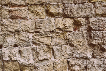 sandstone wall with stones as a background