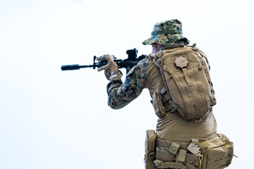 Fototapeta premium soldier in action aiming laseer sight optics