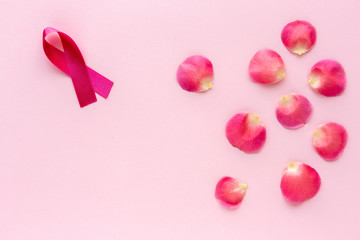 Pink ribbon on a colored background. Cancer