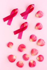 Pink ribbon on a colored background. Cancer
