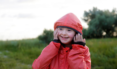 Portrait of little girl smiling outside