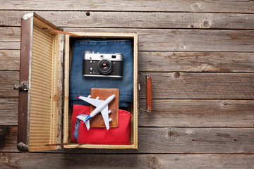 Suitcase with clothes and travel accessories