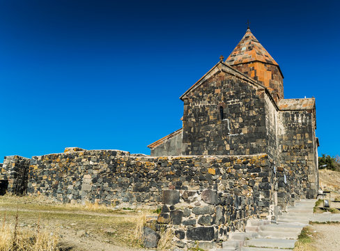 Old orthodox monastery Sevanavank located on a peninsula at the northwestern shore of Lake Sevan in Armenia. View during autumn sunny day 