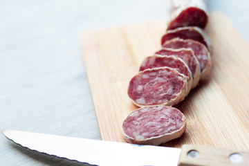 sausage sliced on wood, meat and sausages