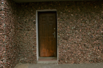 wooden door leading to an old stone house