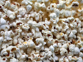 Cloose-up of the popcorn texture. Background popcorn cernels
