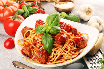 Spaghetti pasta with meatballs and tomato sauce with basil and parmesan