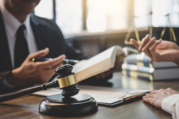 Businesswoman and Male lawyer or judge consult having team meeting with client, Law and Legal...